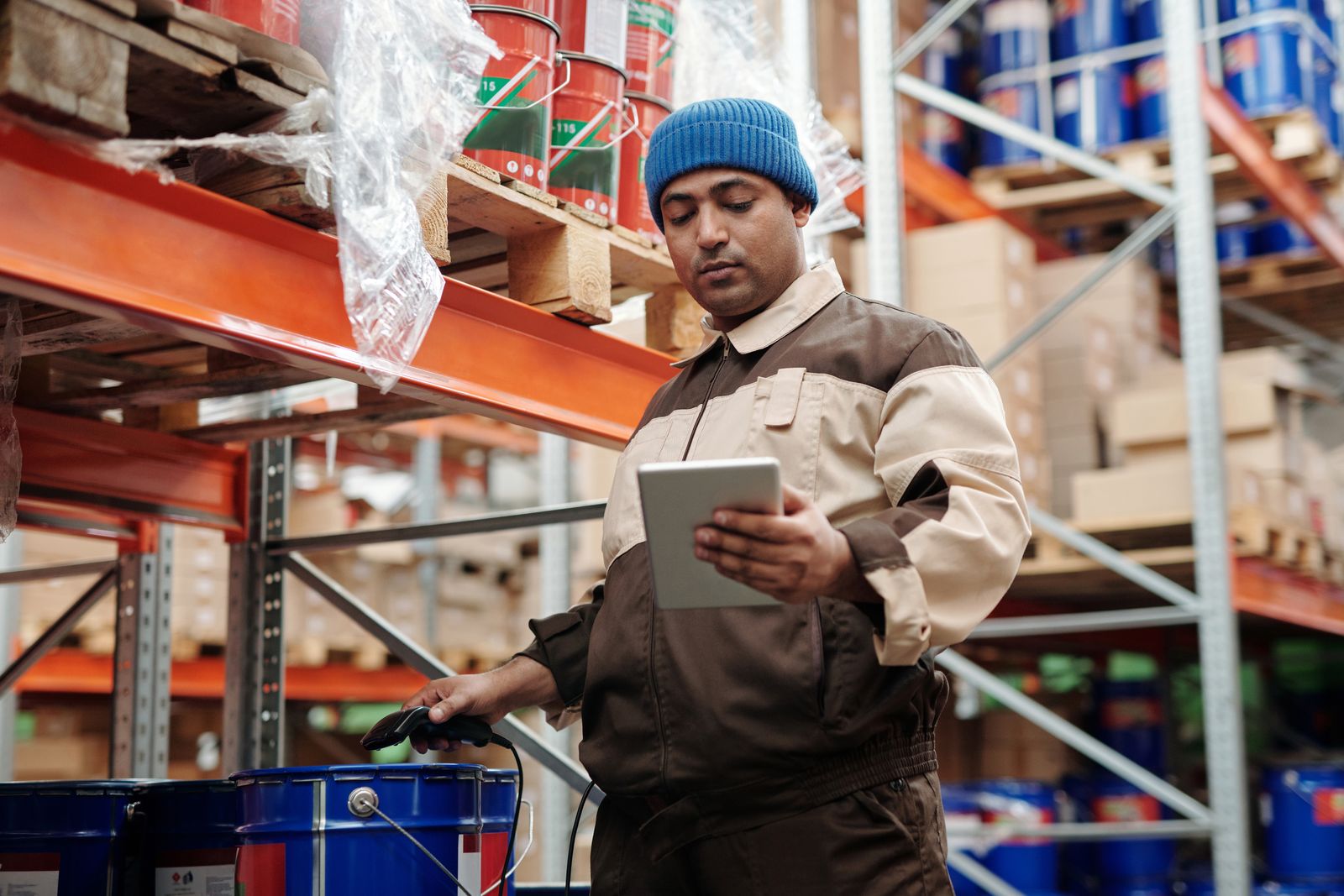 Employee counting assets with a tablet during the annual stocktake